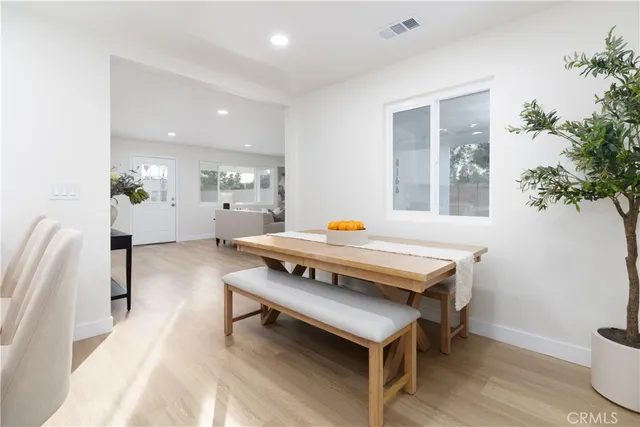 a kitchen with a sink a stove and cabinets