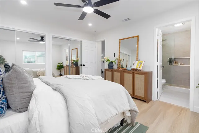 a bathroom with a sink mirror and shower
