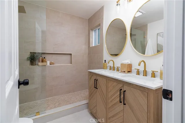 a bedroom with bed and a chandelier