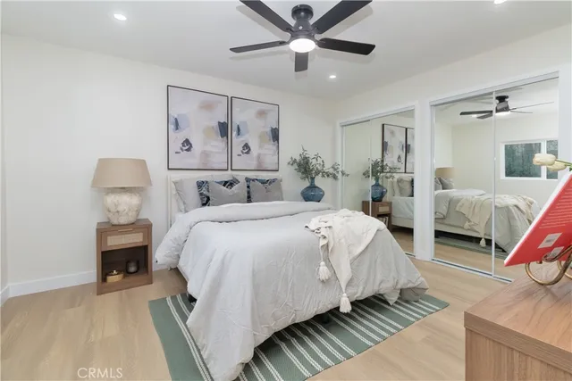 a bedroom with a bed and a couch