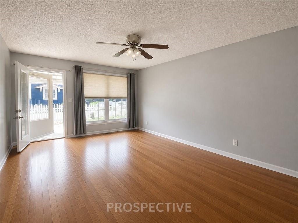 215 Maple Street Kittanning, PA 16201 - Photo 3 of 39 a view of an empty room with wooden floor and a window