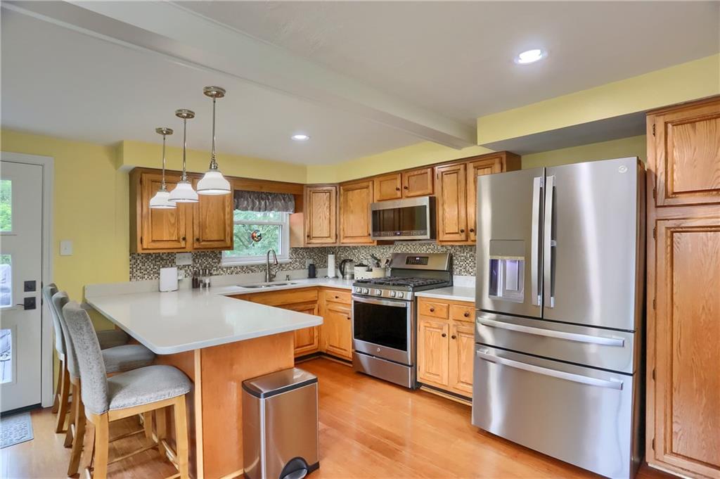 141 Ridge Avenue Pittsburgh, PA 15237 - Photo 17 of 39 Abundant cabinetry, stainless steel appliances and gorgeous counters complemented with a custom backsplash are highlights.