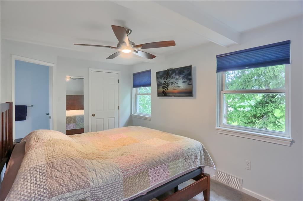 141 Ridge Avenue Pittsburgh, PA 15237 - Photo 22 of 39 A ceiling fan is featured in the primary bedroom.