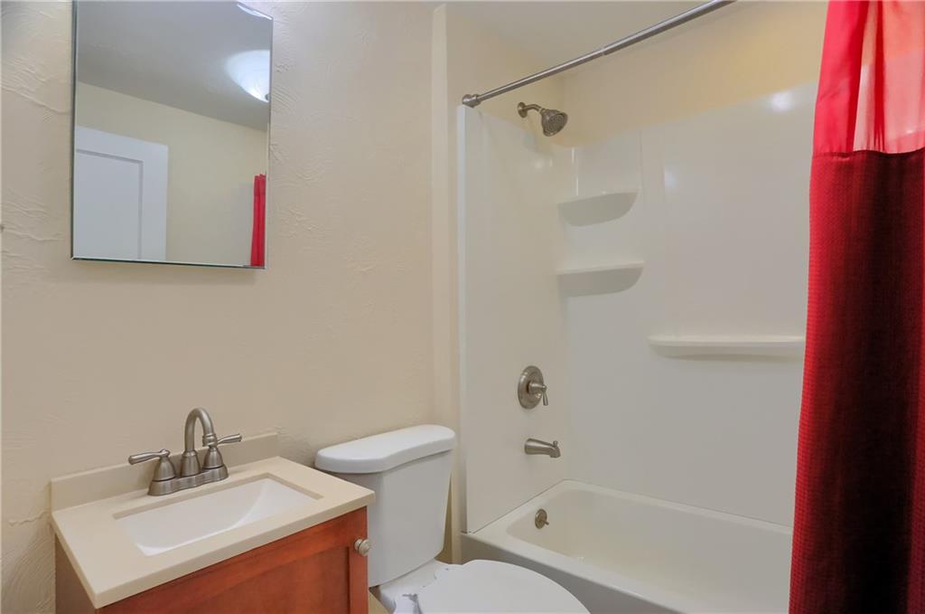141 Ridge Avenue Pittsburgh, PA 15237 - Photo 25 of 39 The shared hall bathroom has a tub/shower combo and modern vanity.