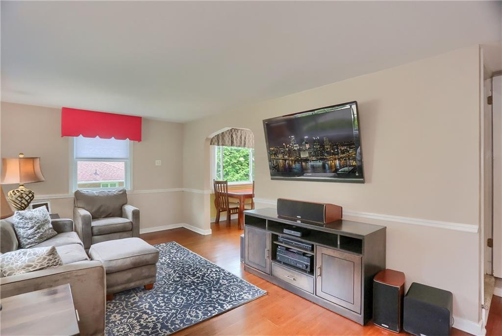 141 Ridge Avenue Pittsburgh, PA 15237 - Photo 8 of 39 A light and bright family room features a chair rail.