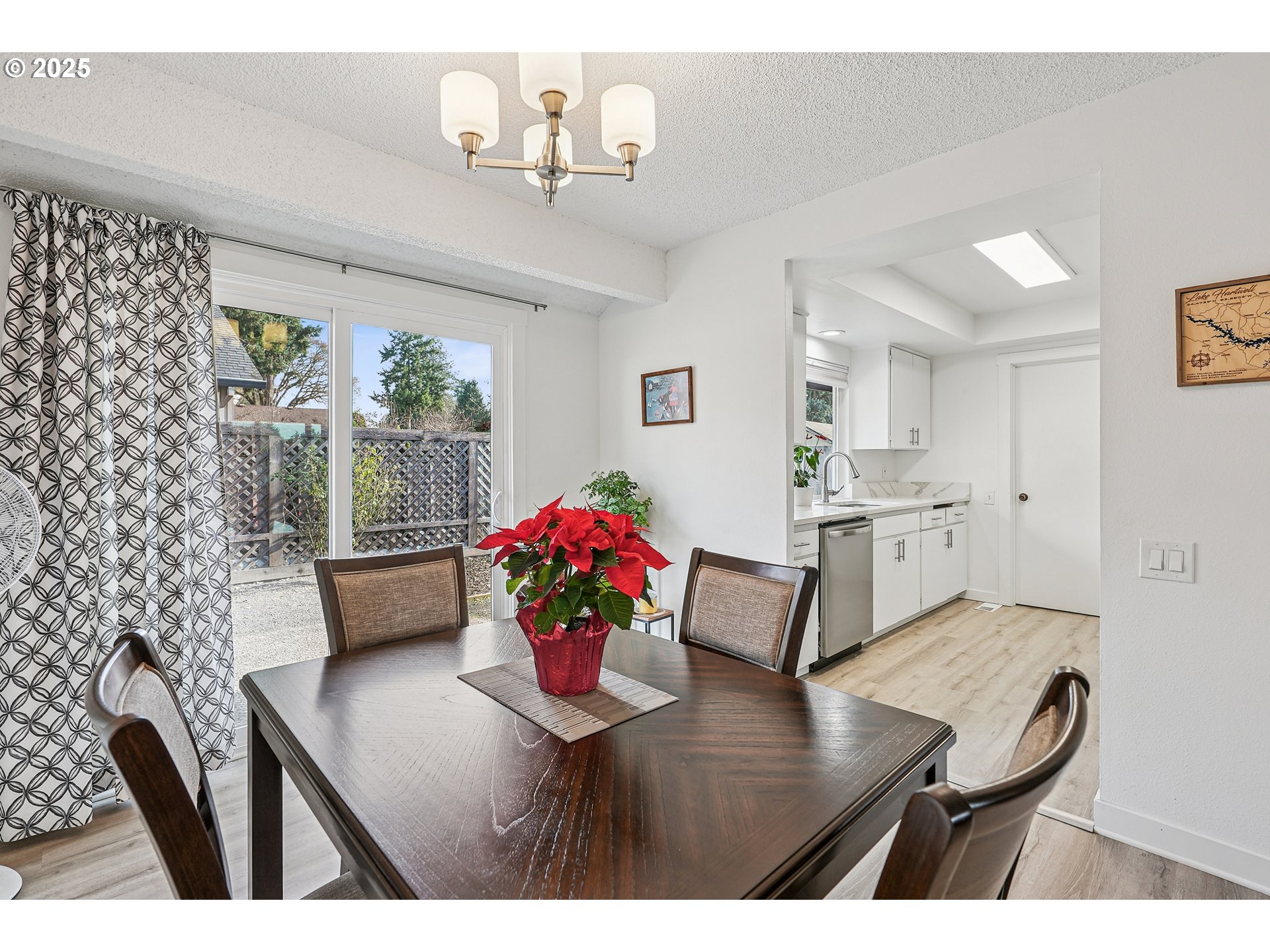 15920 Southwest Century Oak Circle Portland, OR 97224 - Photo 14 of 30 a living room with furniture wooden floor and a chandelier
