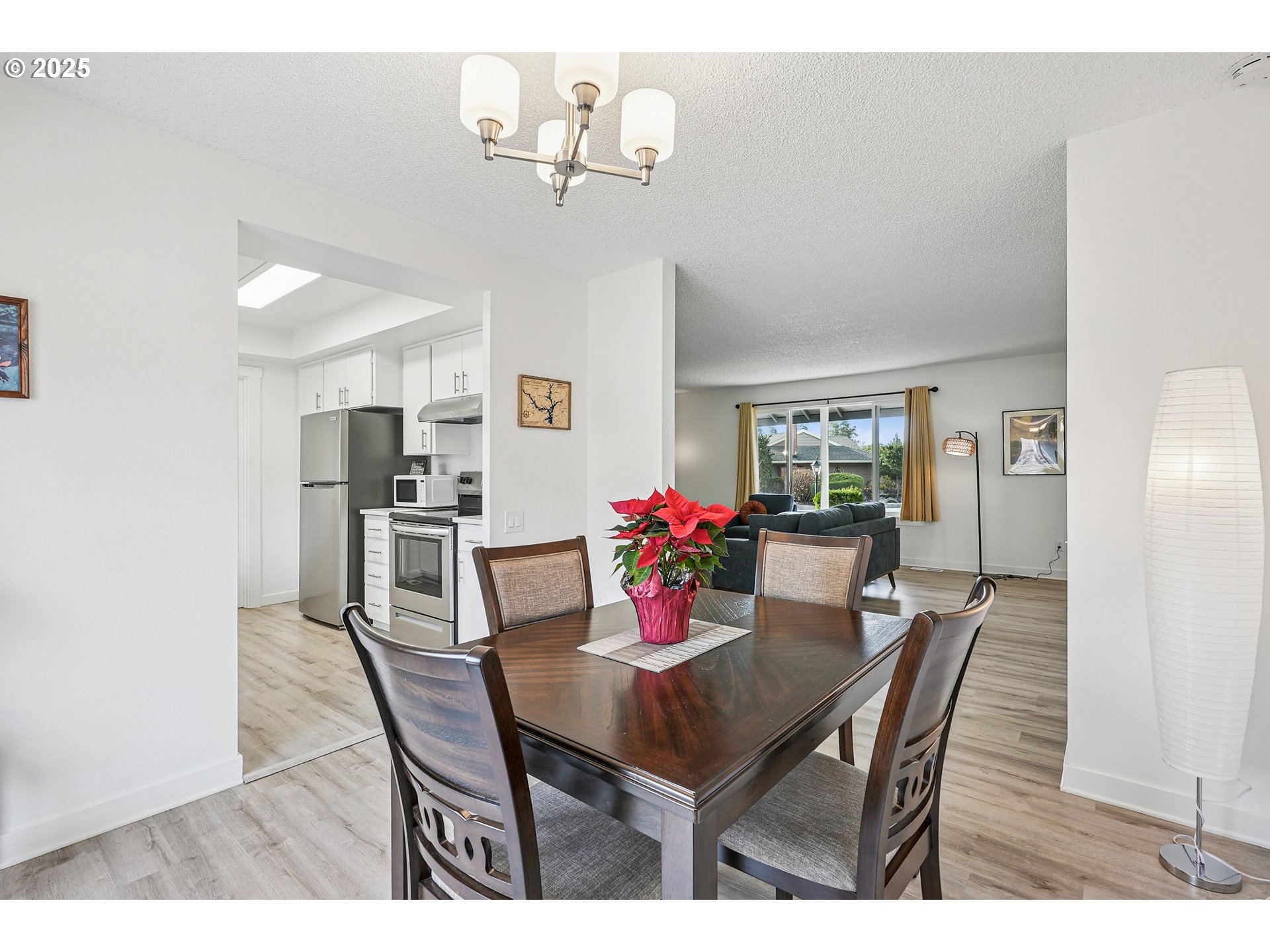15920 Southwest Century Oak Circle Portland, OR 97224 - Photo 15 of 30 a view of a dining room with furniture and chandelier