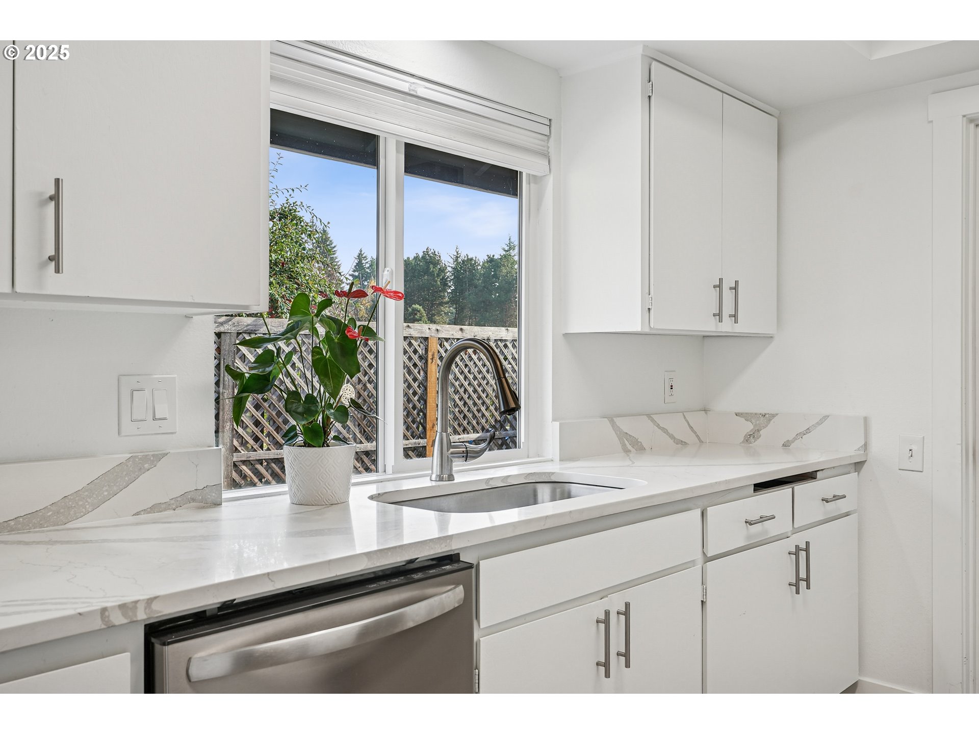 15920 Southwest Century Oak Circle Portland, OR 97224 - Photo 18 of 30 a kitchen with a sink and cabinets