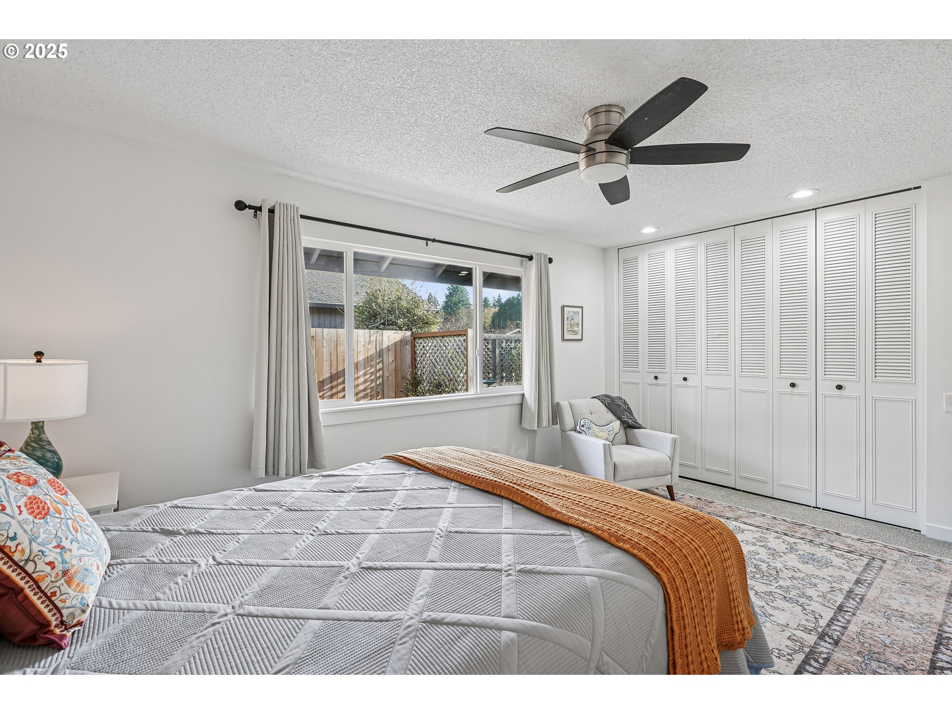 15920 Southwest Century Oak Circle Portland, OR 97224 - Photo 23 of 30 a bedroom with a large bed and a window