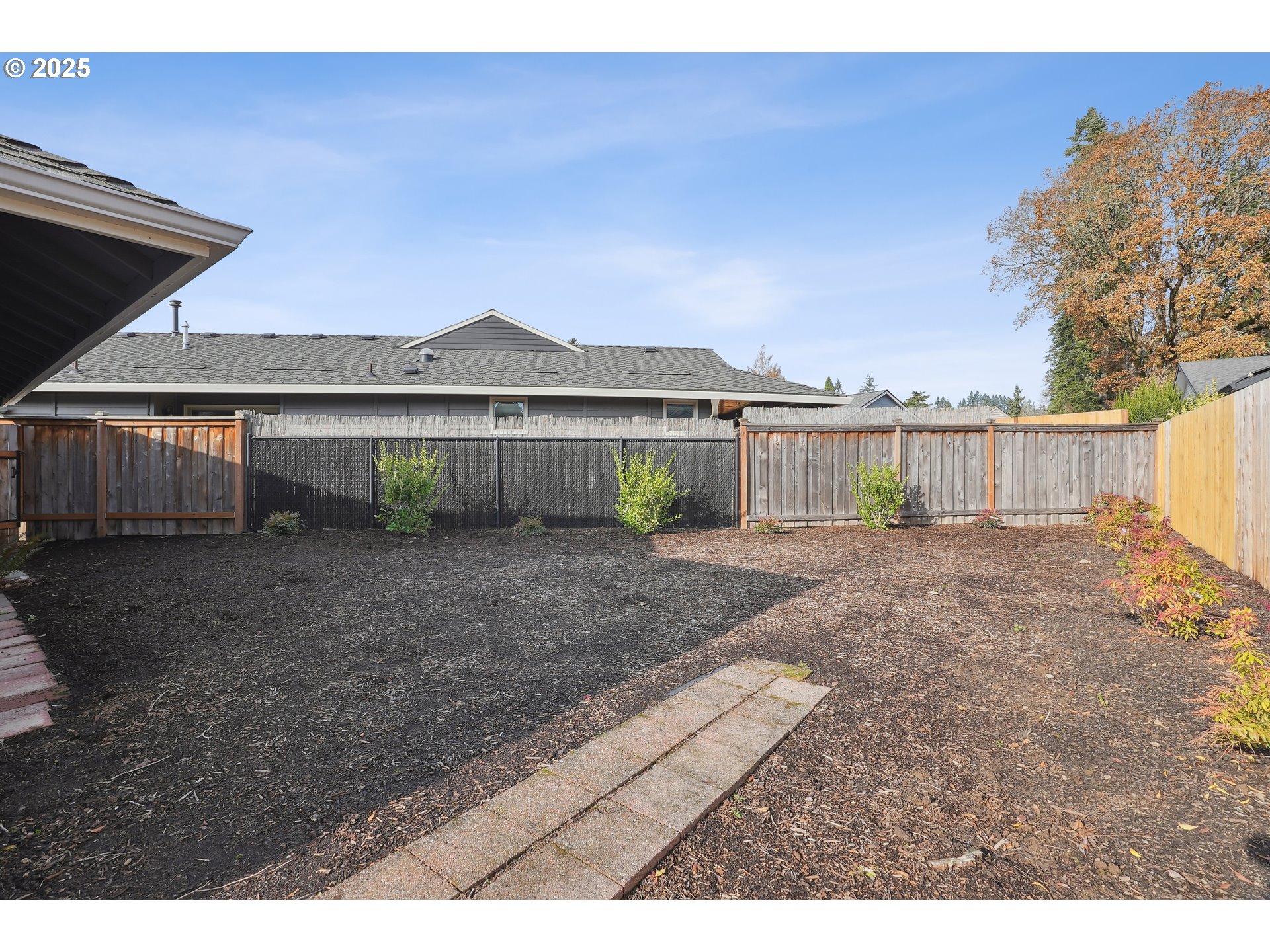 15920 Southwest Century Oak Circle Portland, OR 97224 - Photo 28 of 30 a view of house with a yard and a wooden fence