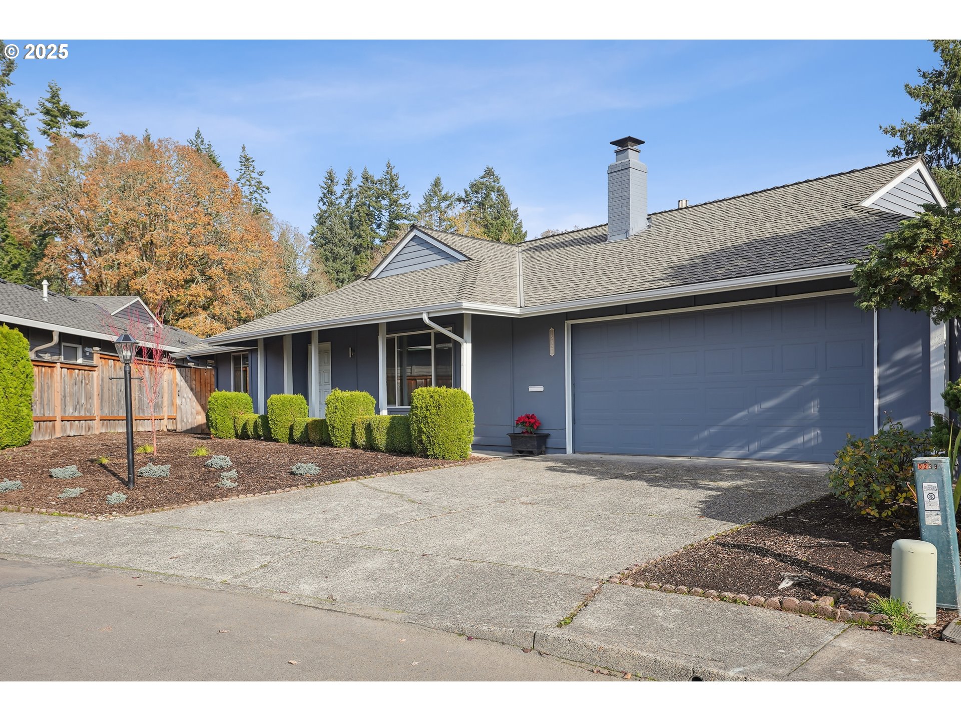 15920 Southwest Century Oak Circle Portland, OR 97224 - Photo 5 of 30 a front view of a house with a yard and garage