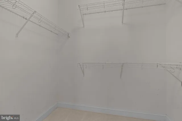 a bathroom with a tub a sink a mirror and a shower