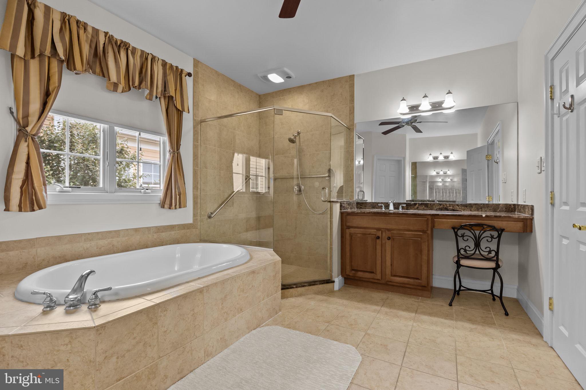 3541 Reading Way Huntingdon Valley, PA 19006 - Photo 33 of 54 a bathroom with a tub a sink a mirror and a shower