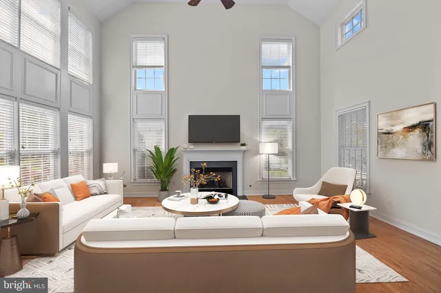 a living room with fireplace furniture and a flat screen tv