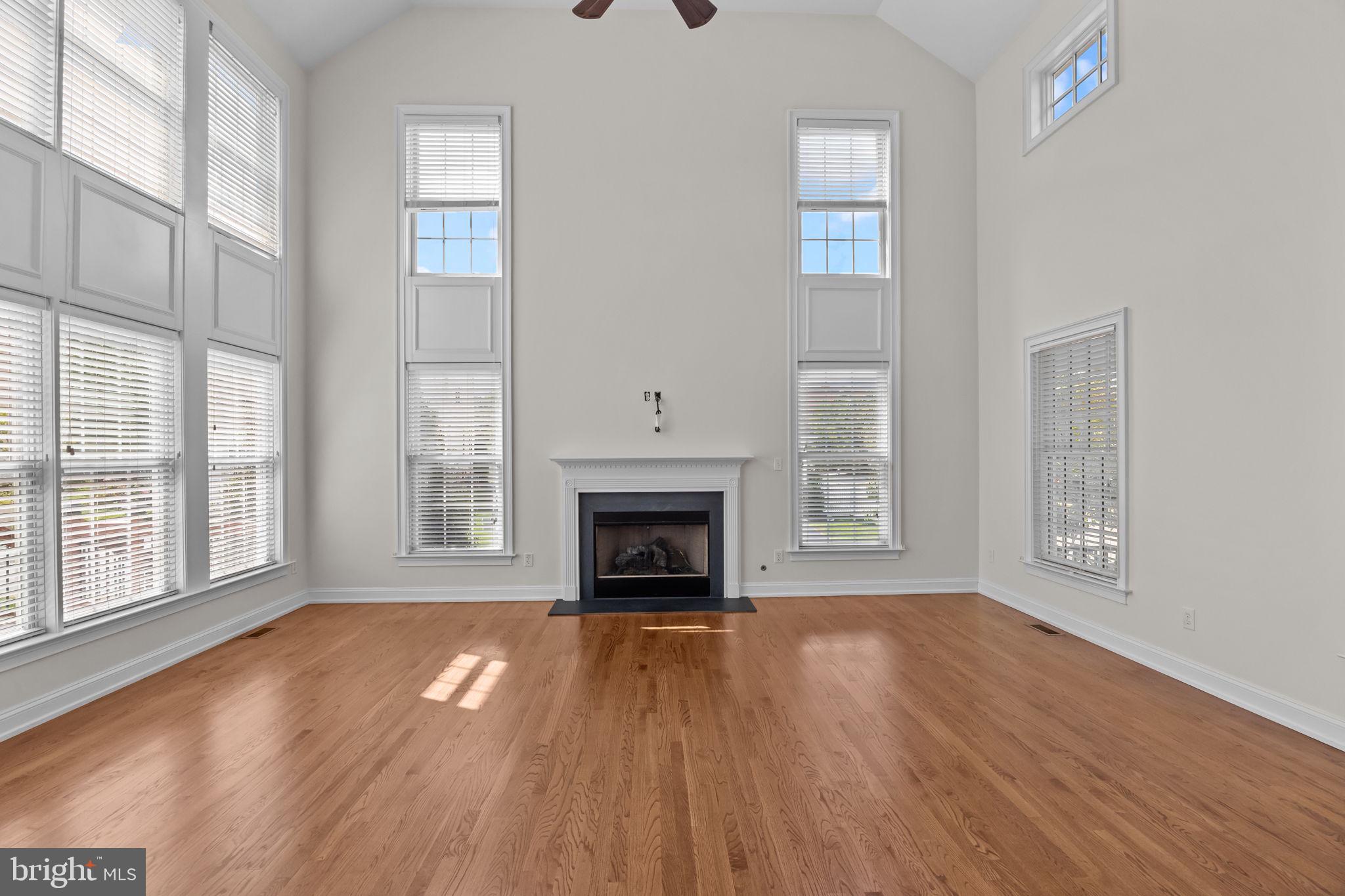 3541 Reading Way Huntingdon Valley, PA 19006 - Photo 8 of 54 a view of an empty room with wooden floor fireplace and a window