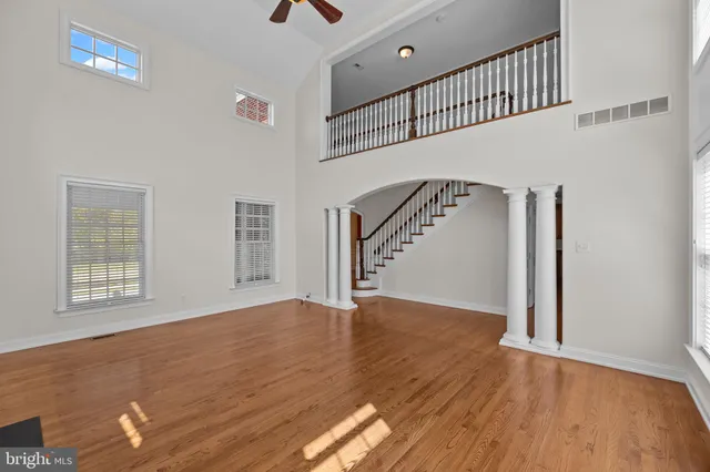 a view of an entryway with wooden floor