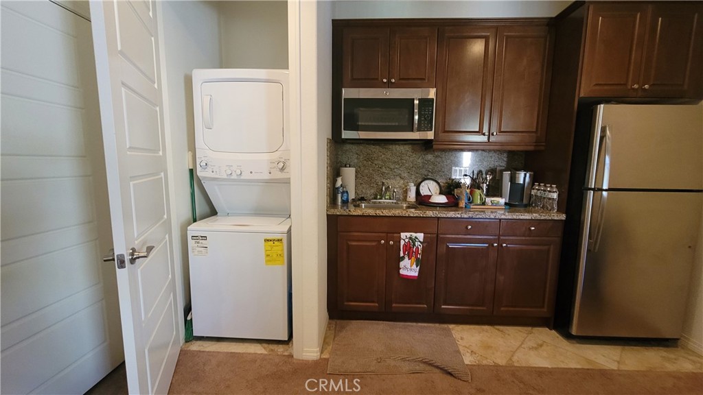 12349 Rodeo Drive, Unit B Rancho Cucamonga, CA 91739 - Photo 11 of 22 There is a stacked washer & drier for your own private use.