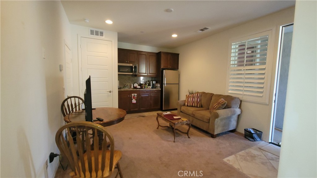 12349 Rodeo Drive, Unit B Rancho Cucamonga, CA 91739 - Photo 8 of 22 This apartment has a living/dining area and a kitchenette when you first walk in.