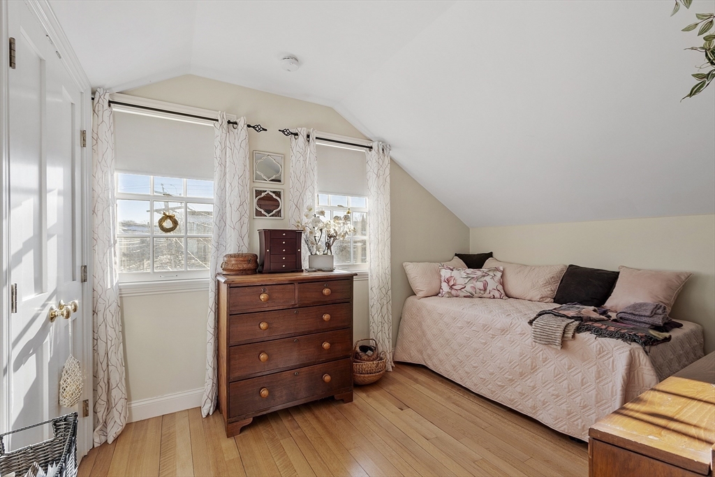 1 Dock Square Rockport, MA 01966 - Photo 19 of 34 a room with a bed and a mirror