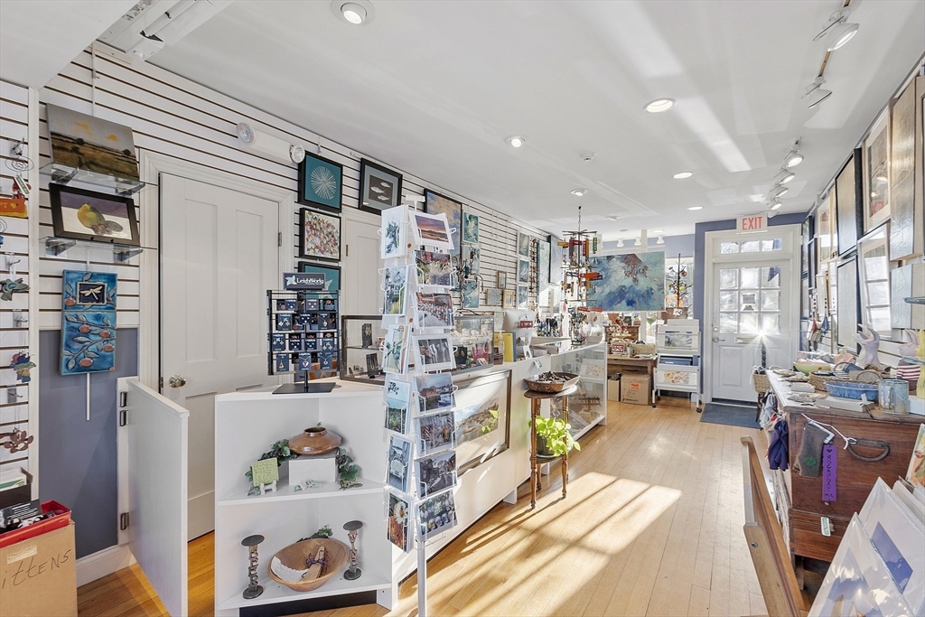 1 Dock Square Rockport, MA 01966 - Photo 25 of 34 a living room with furniture and a book shelf