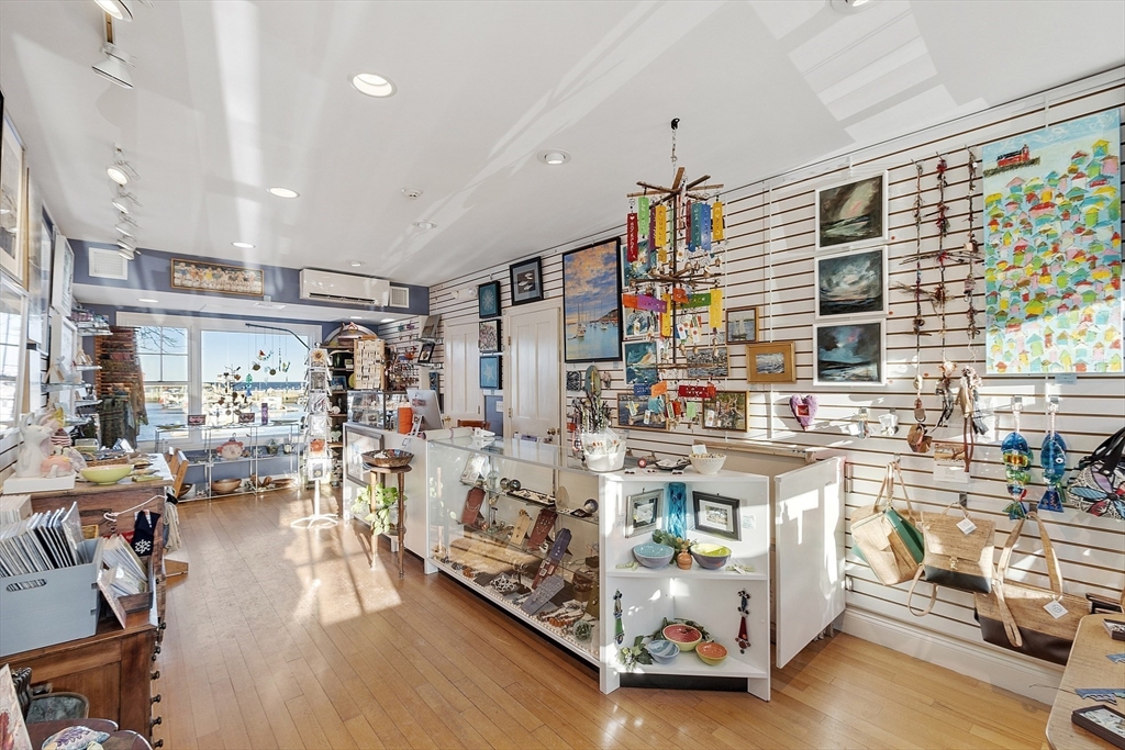 1 Dock Square Rockport, MA 01966 - Photo 27 of 34 a living room with lots of furniture and a chandelier