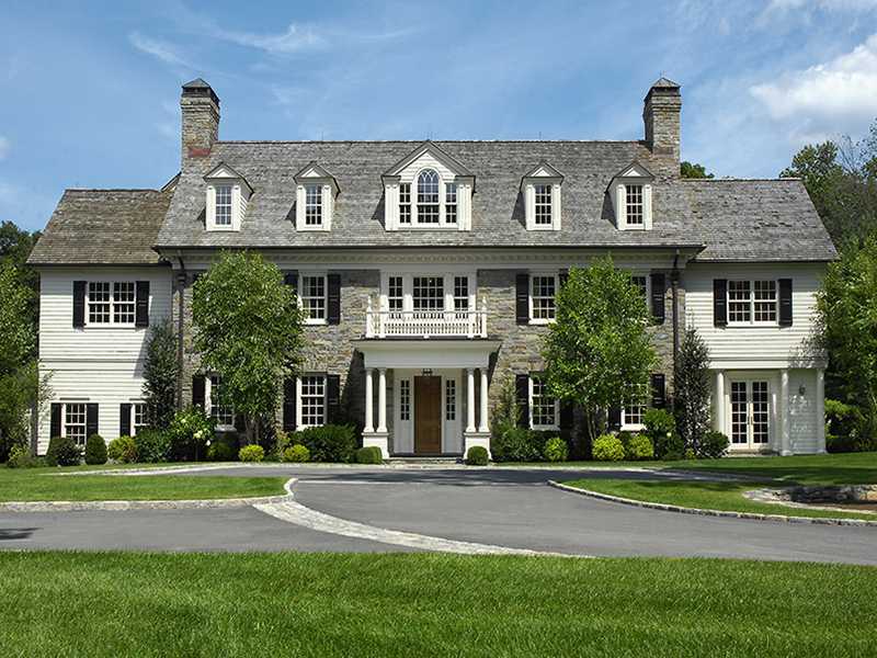 717 Riversville Road Greenwich, CT 06831 - Photo 1 of 24 a front view of a house with a yard