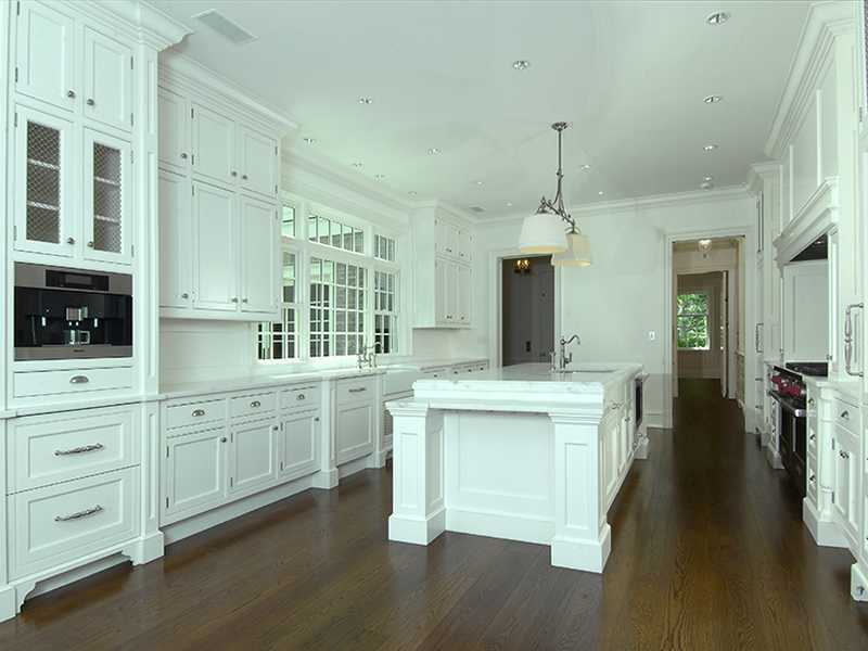 717 Riversville Road Greenwich, CT 06831 - Photo 14 of 24 a kitchen with white cabinets and sink