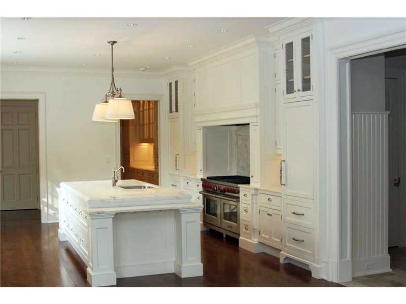 717 Riversville Road Greenwich, CT 06831 - Photo 15 of 24 a kitchen view with granite countertop a sink dishwasher a stove and a wooden floor