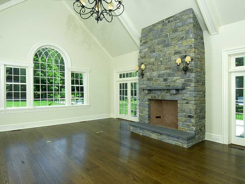 717 Riversville Road Greenwich, CT 06831 - Photo 16 of 24 a view of livingroom with window wooden floor and front door