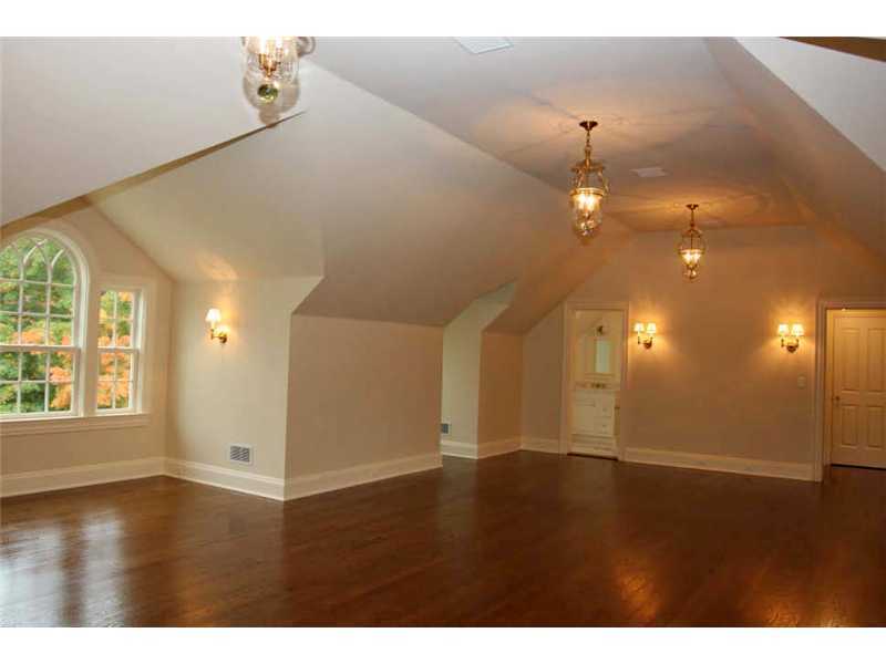 717 Riversville Road Greenwich, CT 06831 - Photo 19 of 24 a view of an empty room with wooden floor and a window