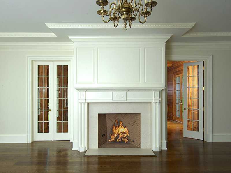 717 Riversville Road Greenwich, CT 06831 - Photo 7 of 24 a living room with a fireplace and wooden floor