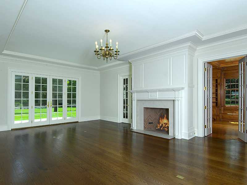 717 Riversville Road Greenwich, CT 06831 - Photo 8 of 24 a view of an empty room with wooden floor and a window