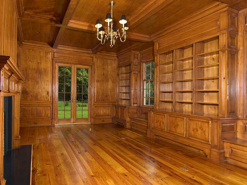 717 Riversville Road Greenwich, CT 06831 - Photo 9 of 24 a view of a room with wooden floor and chandelier