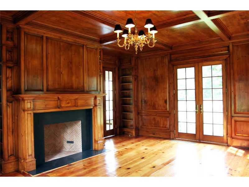 717 Riversville Road Greenwich, CT 06831 - Photo 10 of 24 a view of an empty room with a fireplace and chandelier