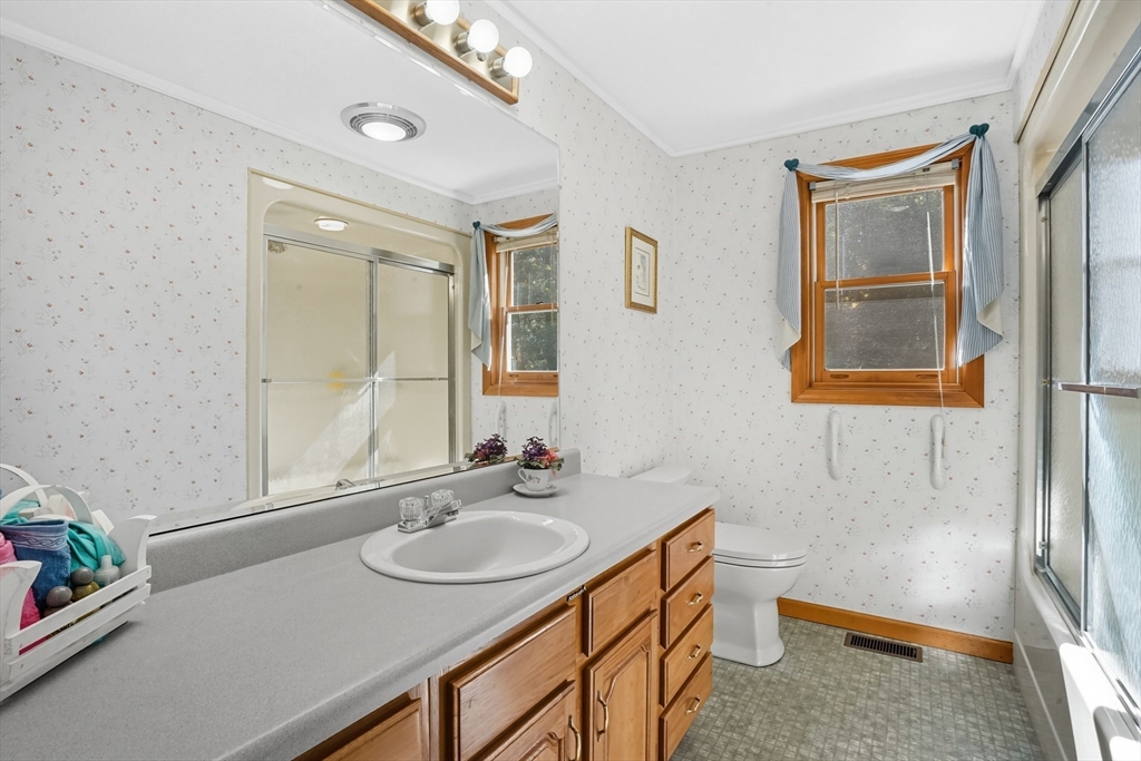 54 Cummings Road Ware, MA 01082 - Photo 19 of 42 a bathroom with a sink double vanity and a mirror