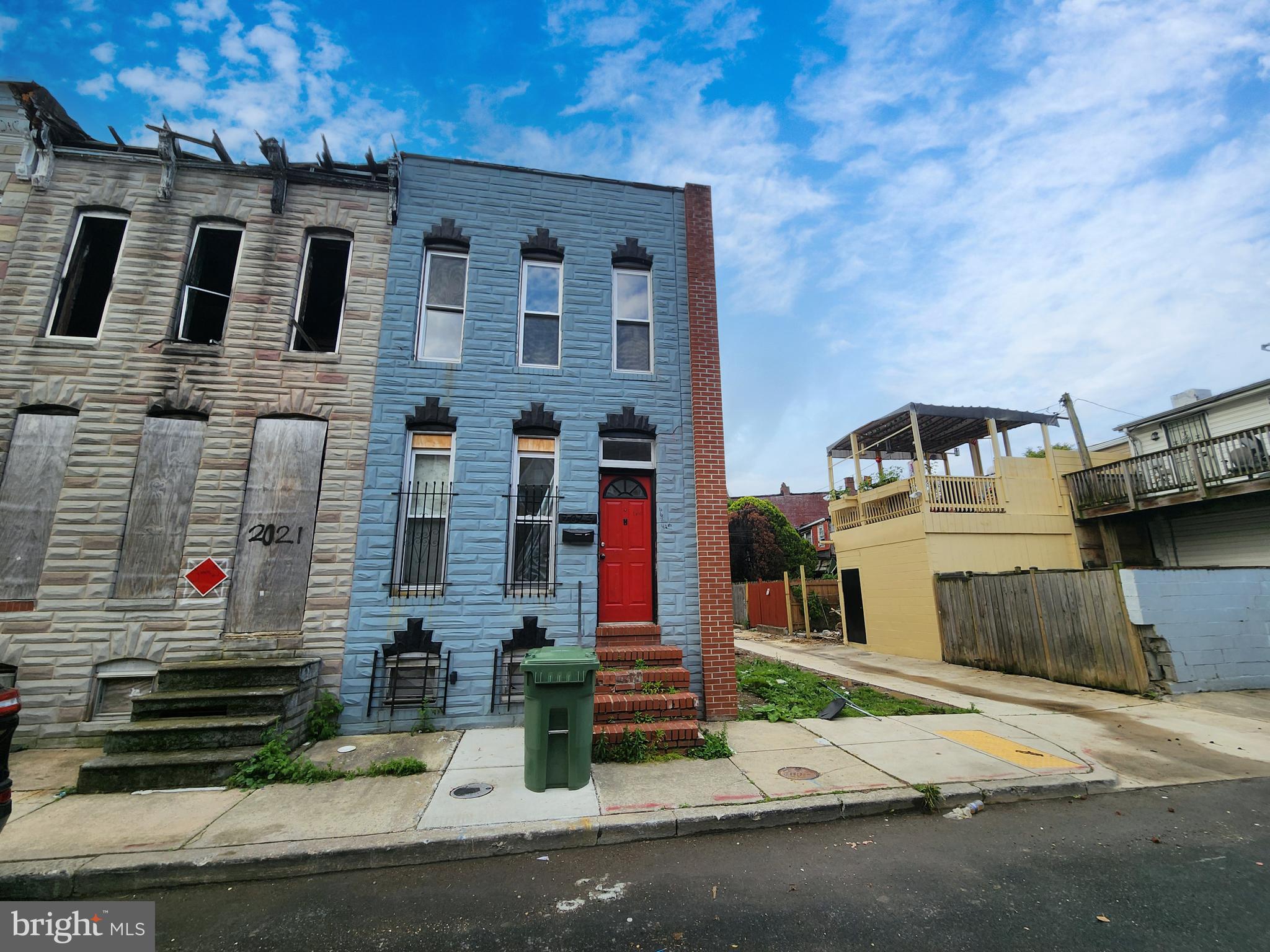 2023 Wilhelm Street Baltimore, MD 21223 - Photo 1 of 5 a front view of a house with a road