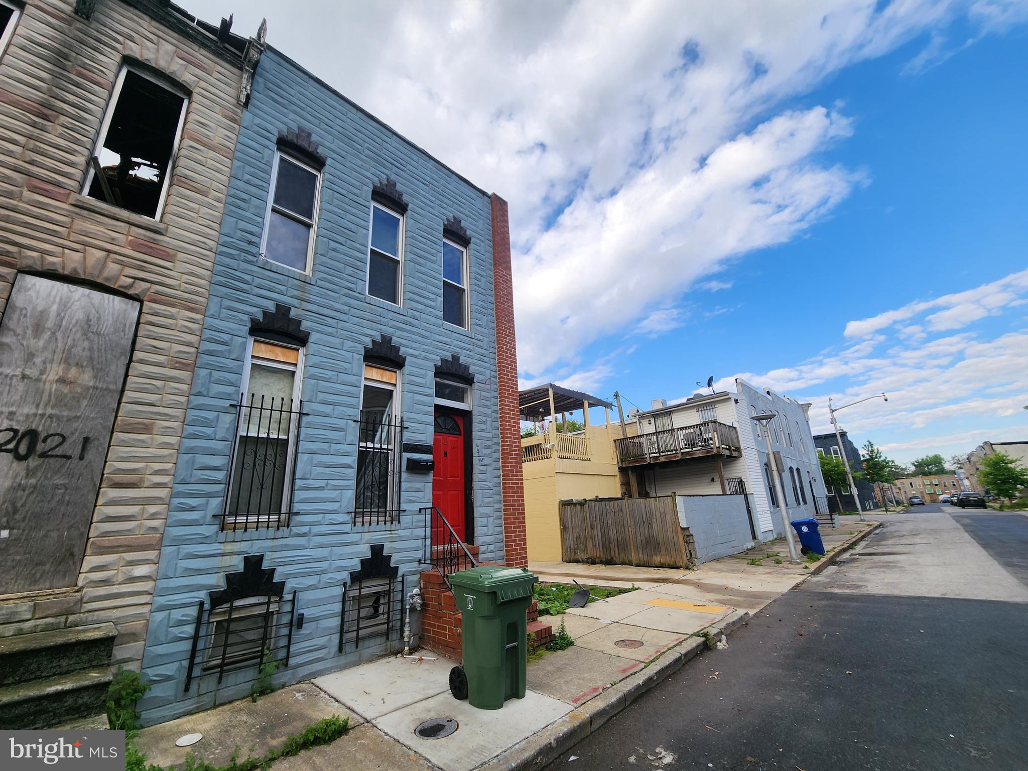 2023 Wilhelm Street Baltimore, MD 21223 - Photo 2 of 5 a front view of a house with parking space