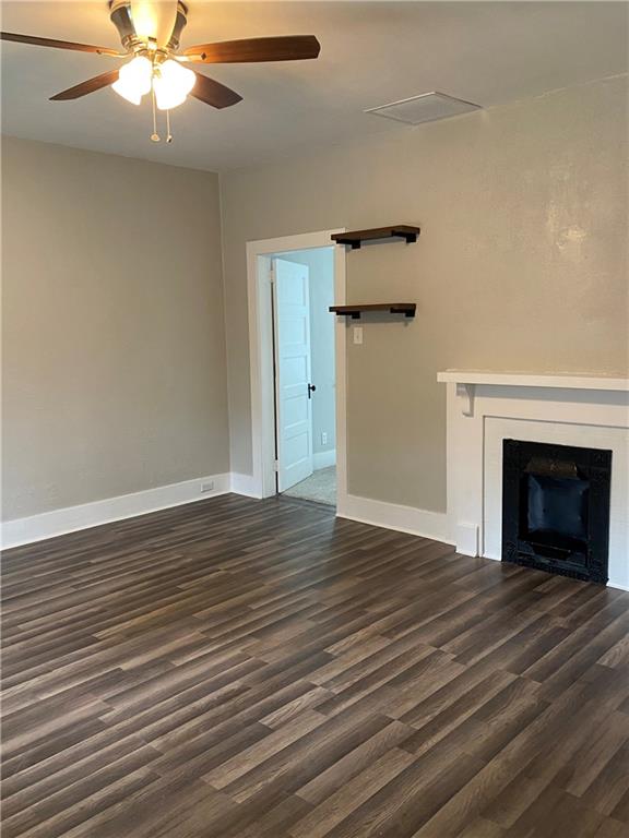 238 Hickory Street McKees Rocks, PA 15136 - Photo 2 of 18 a view of an empty room with wooden floor fireplace and a window