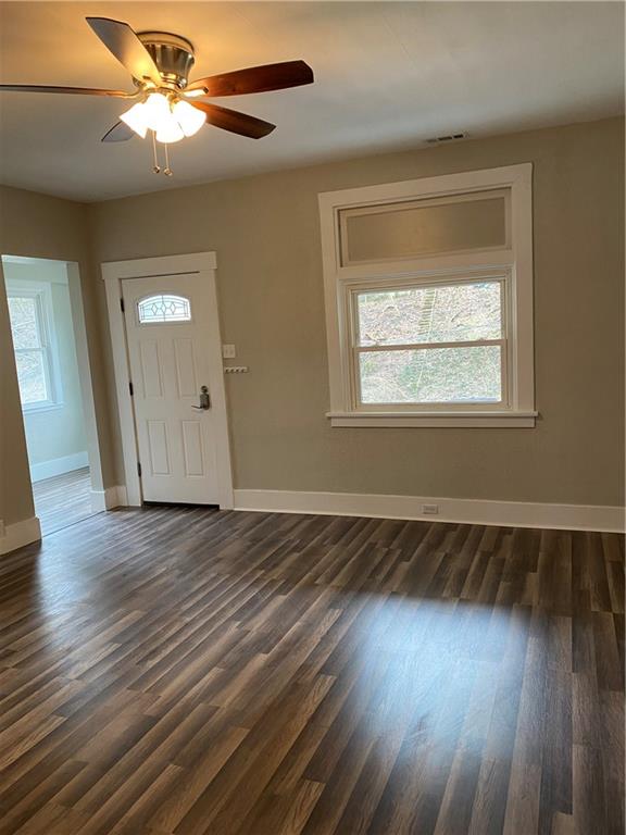 238 Hickory Street McKees Rocks, PA 15136 - Photo 4 of 18 a view of an empty room with wooden floor and a window