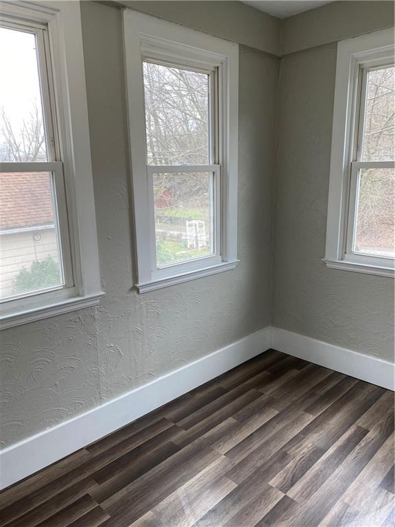 238 Hickory Street McKees Rocks, PA 15136 - Photo 5 of 18 an empty room with wooden floor and windows