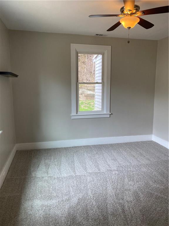 238 Hickory Street McKees Rocks, PA 15136 - Photo 9 of 18 an empty room with a window and a fan