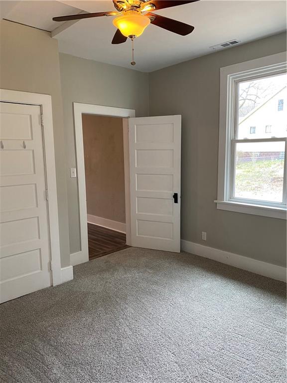 238 Hickory Street McKees Rocks, PA 15136 - Photo 10 of 18 an empty room with a window and chandelier fan