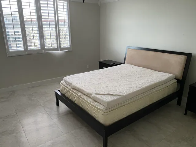 a view of an empty room and wooden floor