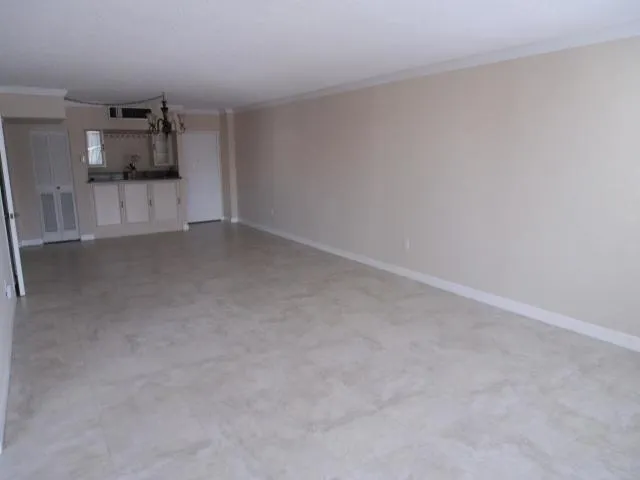 a view of a refrigerator and window in a room