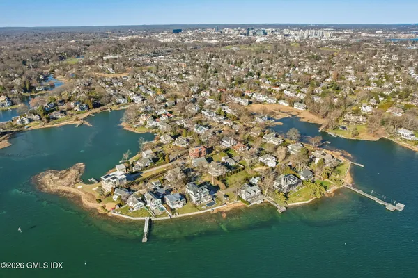 a bedroom with a bed and a dresser in it