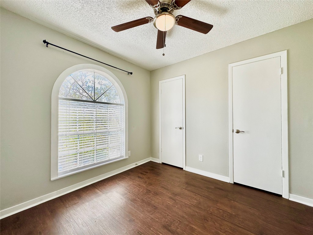 1200 Banister Lane, Unit 2 Austin, TX 78704 - Photo 12 of 14 wooden floor in an empty room with a window