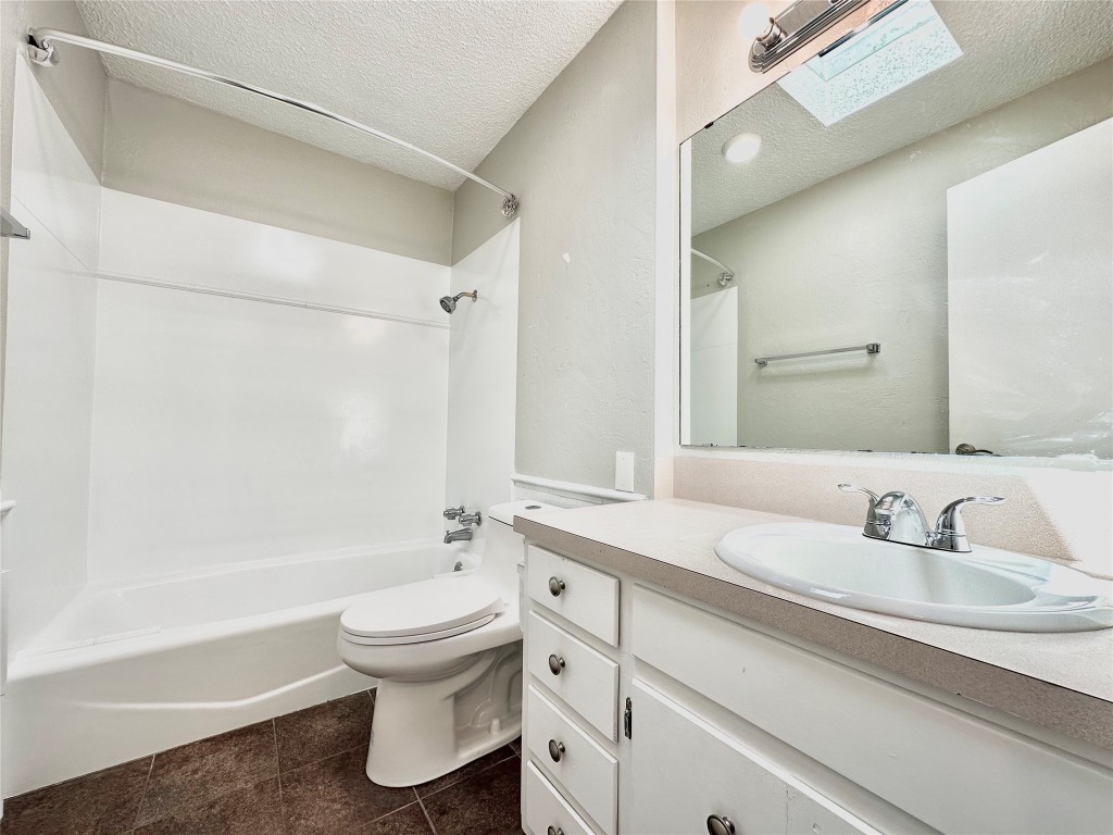 1200 Banister Lane, Unit 2 Austin, TX 78704 - Photo 14 of 14 a bathroom with a sink a toilet and a bathtub