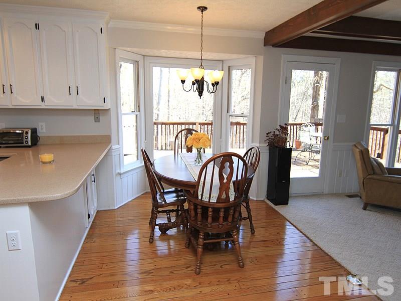5016 Trail Ridge Drive Raleigh, NC 27613 - Photo 12 of 25 a dining room with furniture window wooden floor