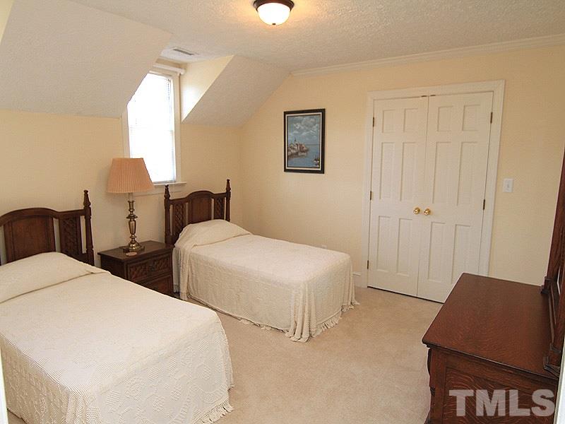 5016 Trail Ridge Drive Raleigh, NC 27613 - Photo 19 of 25 a bedroom with two beds and a chair