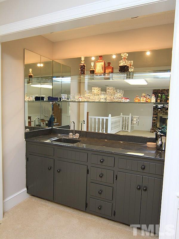 5016 Trail Ridge Drive Raleigh, NC 27613 - Photo 22 of 25 a bathroom with a sink and a mirror